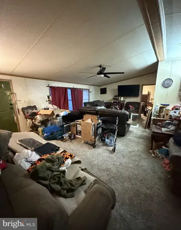 a living room with lots of furniture and a car
