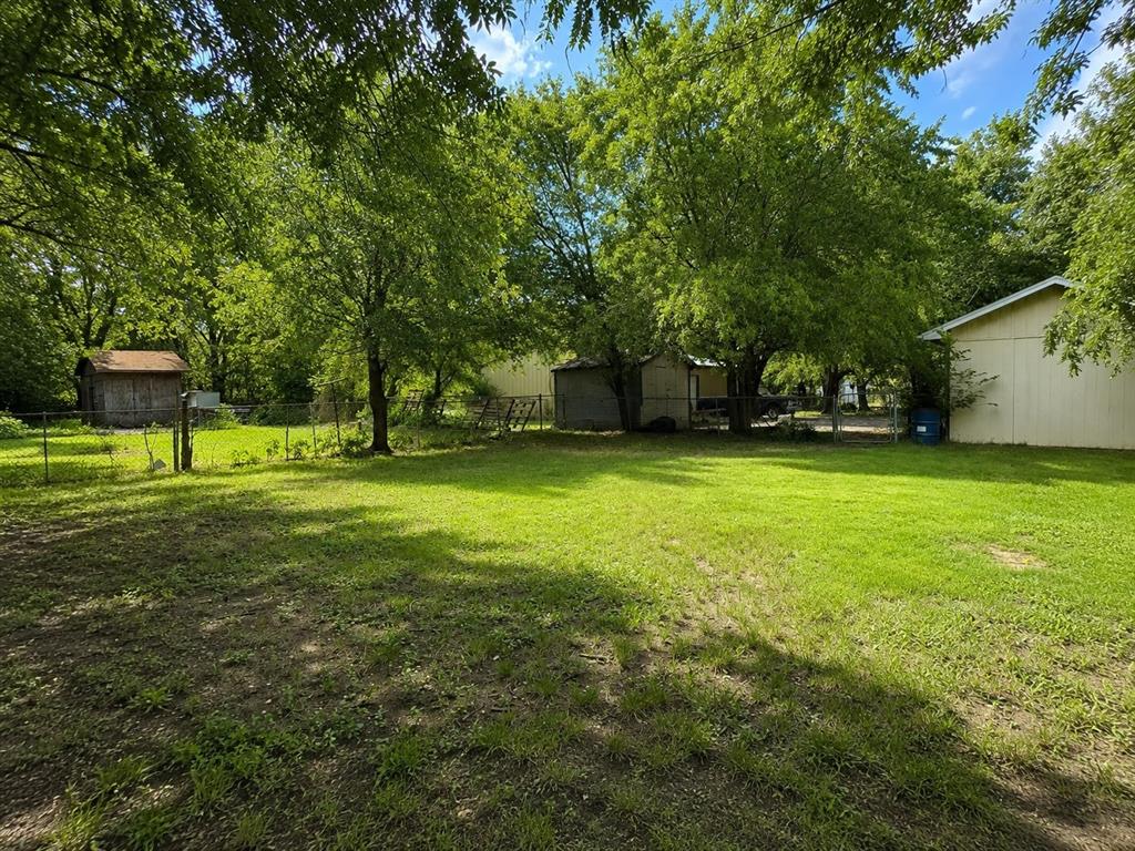 511 Rogers Road Newark, TX 76071 - Photo 3 of 22 Expansive green lawn providing ample space