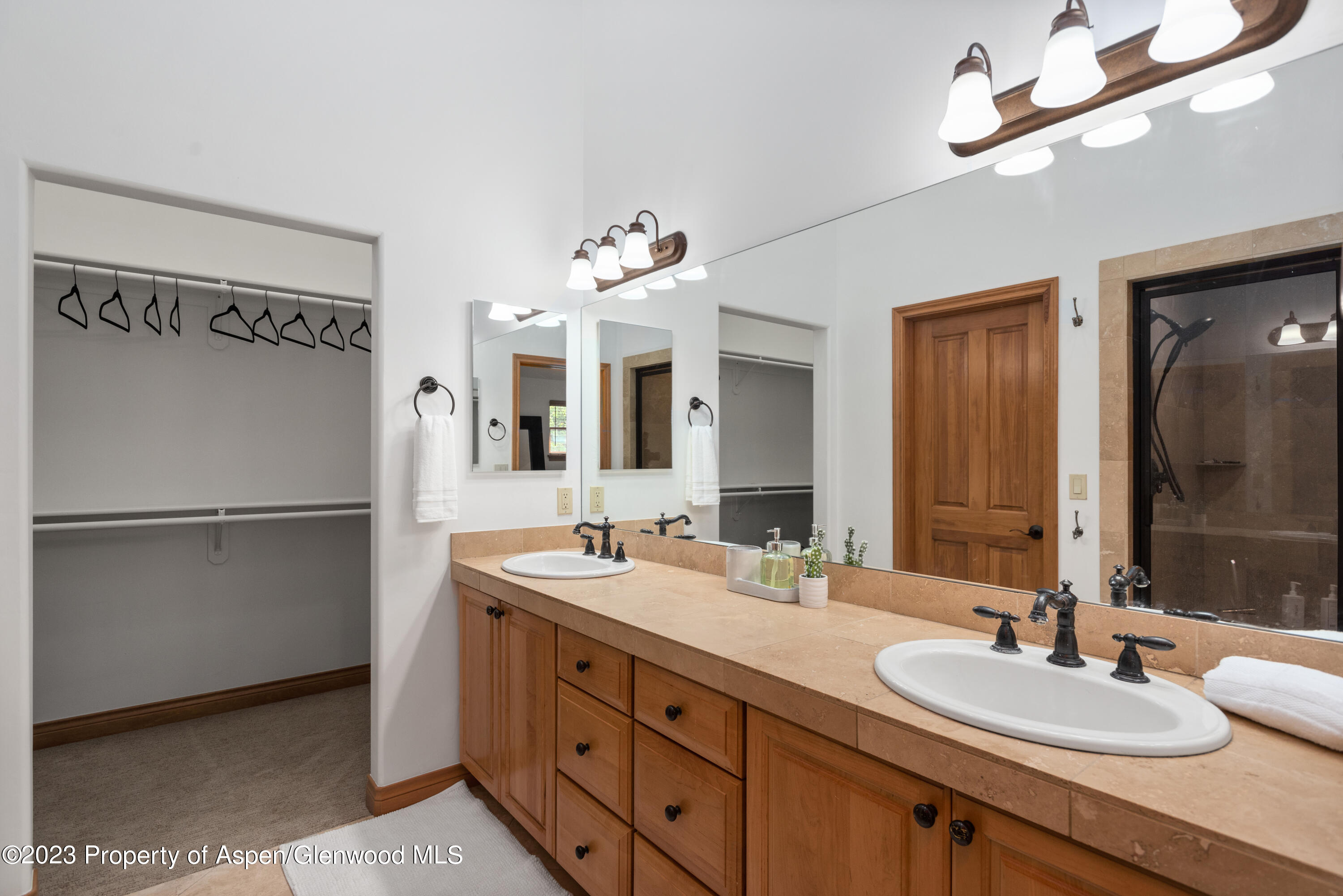 316 Allison Lane, Unit B Basalt, CO 81621 - Photo 15 of 26 a bathroom with a double vanity sink mirror and refrigerator