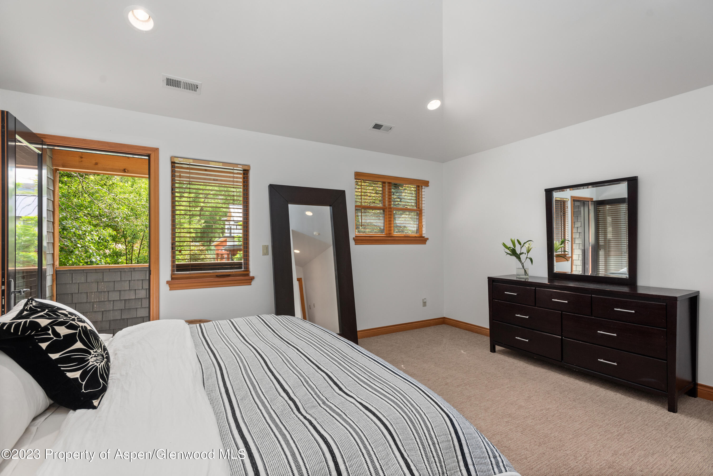 316 Allison Lane, Unit B Basalt, CO 81621 - Photo 17 of 26 a bedroom with a bed and a large window