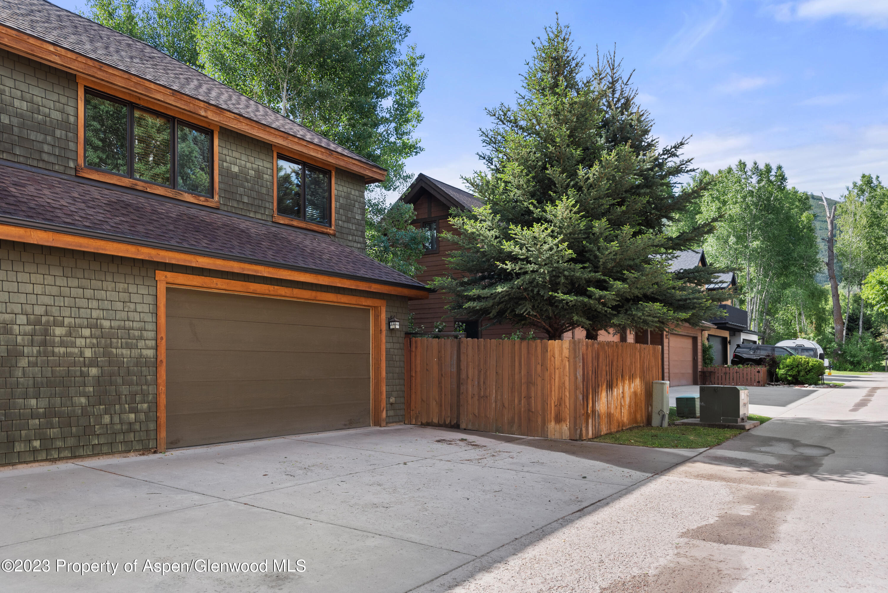 316 Allison Lane, Unit B Basalt, CO 81621 - Photo 24 of 26 a front view of a house with a yard and garage
