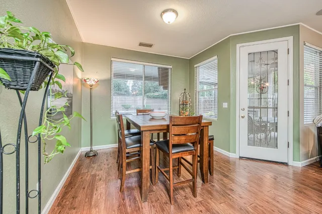 a dining room with furniture window wooden floor