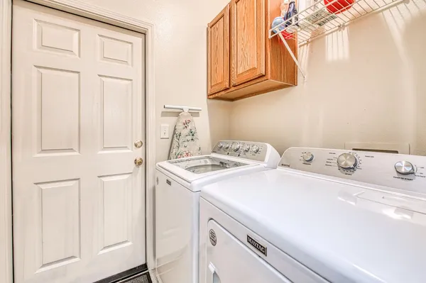 a utility room with dryer and washer