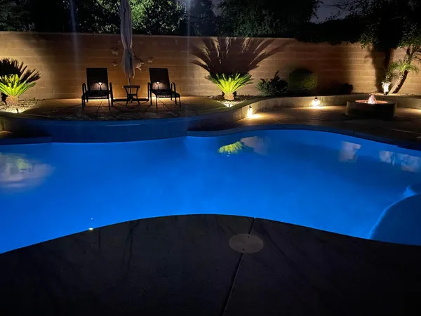 a view of a swimming pool with an outdoor space and seating area