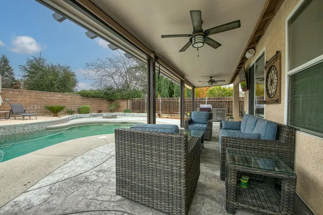 a dining room with furniture and a window