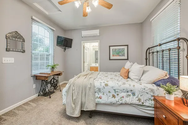 a bedroom with a bed and a table in it