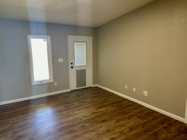 9223 County Road 6700 Lubbock, TX 79403 - Photo 19 of 60 a view of empty room with wooden floor and fan