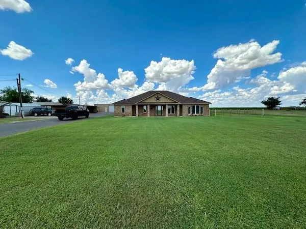 a view of a house with a big yard