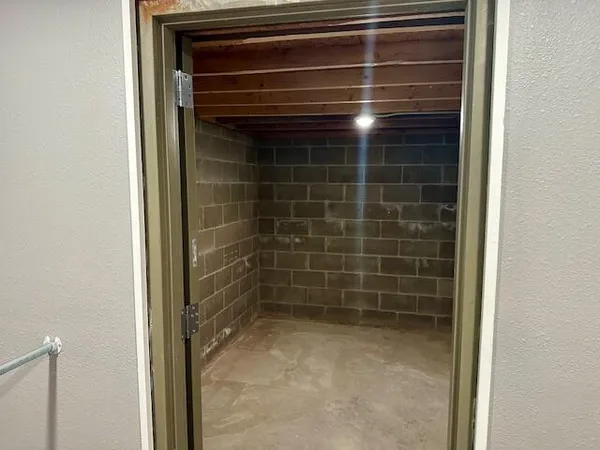 a bathroom with a tub and a double vanity sink