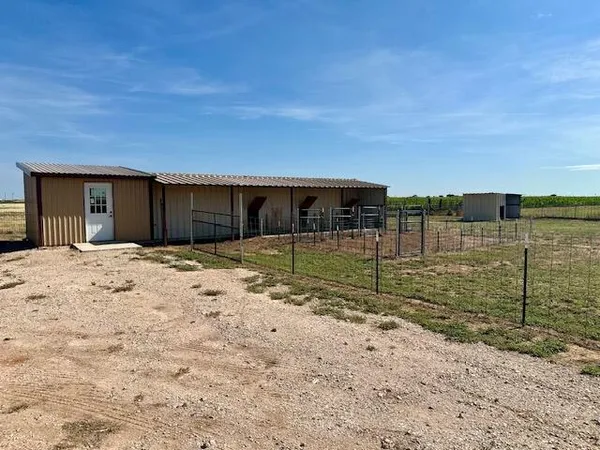 a view of a swimming pool with a house