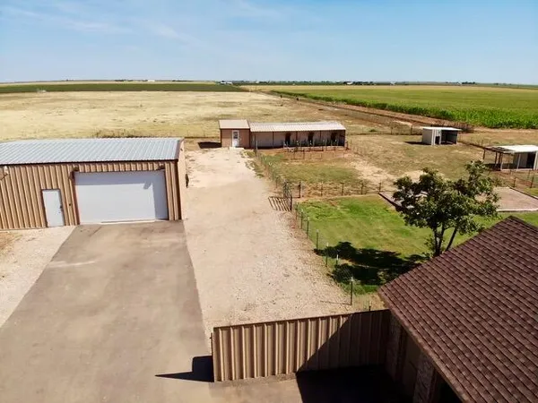 an aerial view of a house with a garden