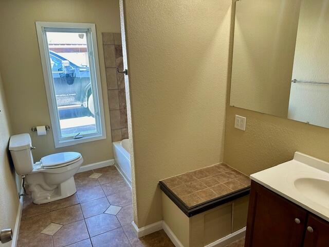 9223 County Road 6700 Lubbock, TX 79403 - Photo 6 of 60 a bathroom with a toilet a sink and a mirror
