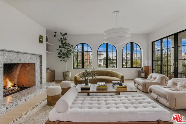 a living room with furniture large window and flat screen tv