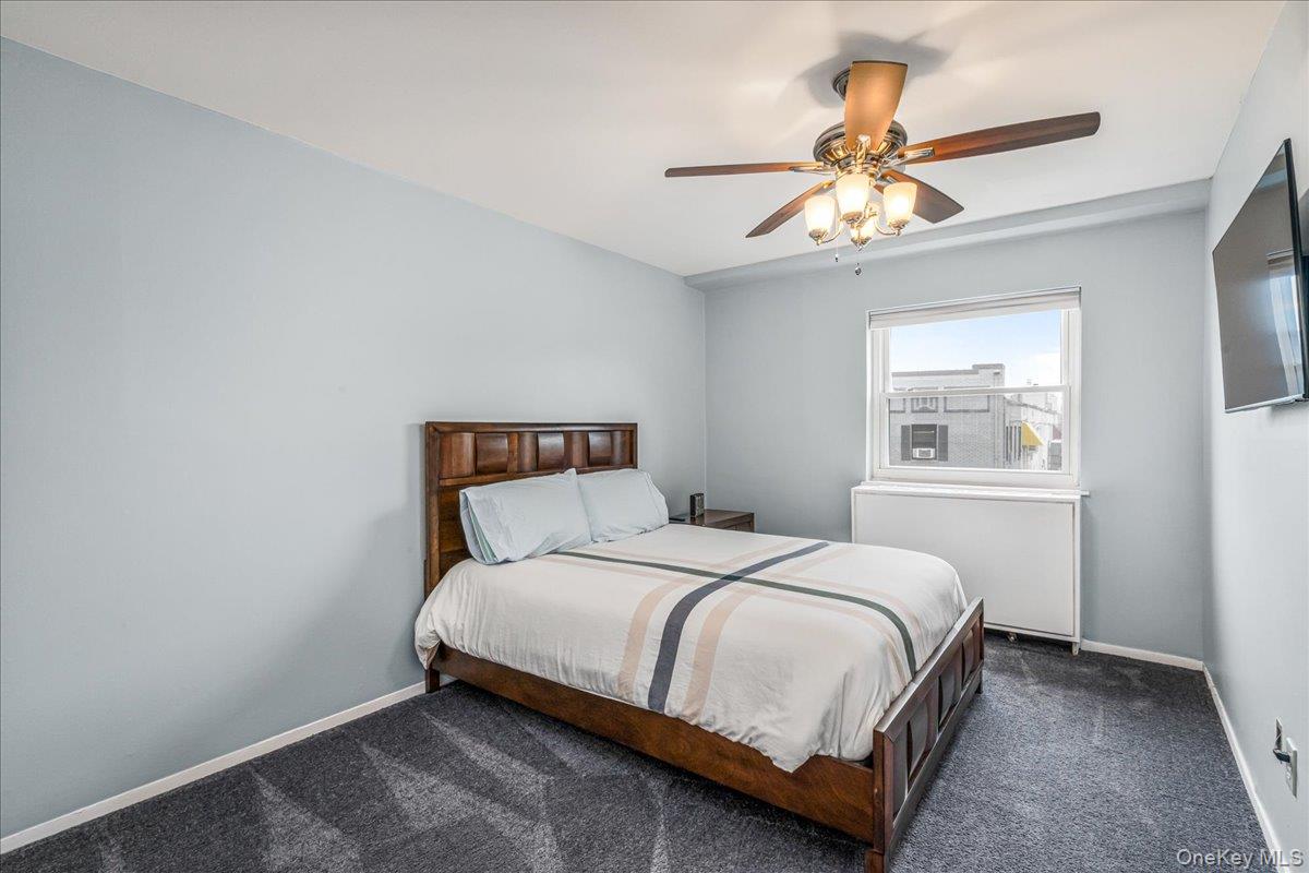 10 Lenox Road, Unit 2F Rockville Centre, NY 11570 - Photo 15 of 21 a bedroom with a bed and window