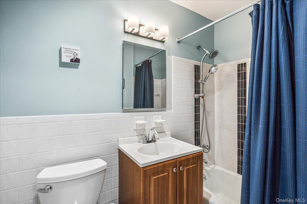 10 Lenox Road, Unit 2F Rockville Centre, NY 11570 - Photo 18 of 21 a bathroom with a sink toilet and shower