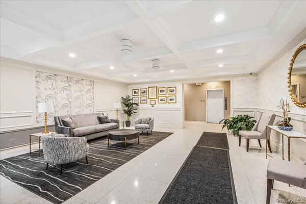 a living room with furniture wooden floor and a table