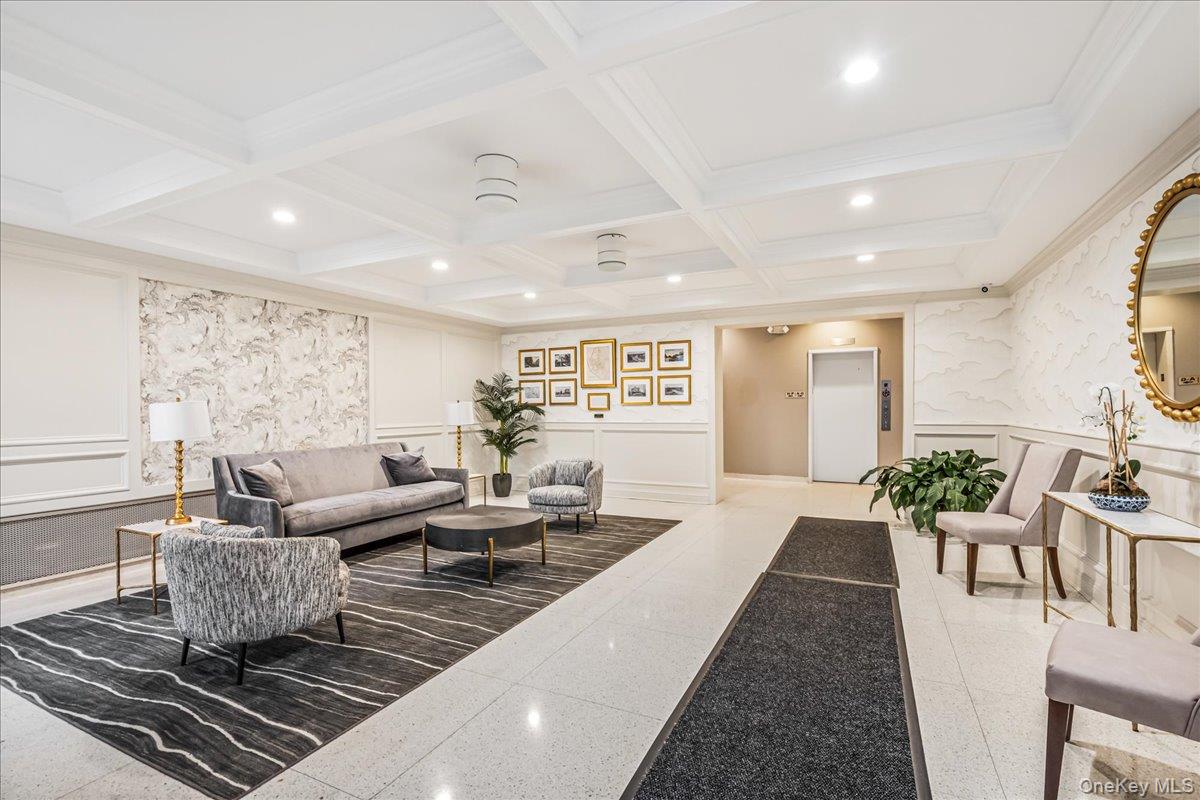 10 Lenox Road, Unit 2F Rockville Centre, NY 11570 - Photo 2 of 21 a living room with furniture wooden floor and a table