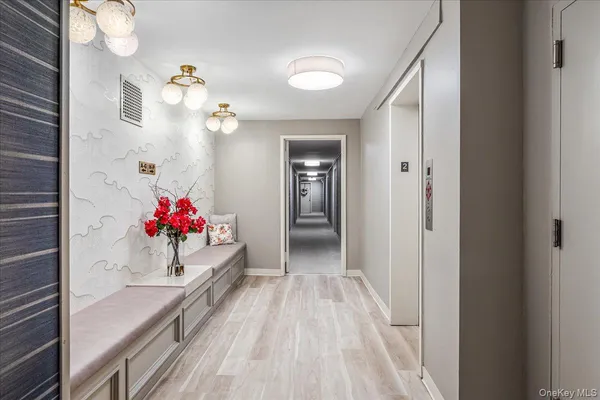 a view of a hallway with a chandelier