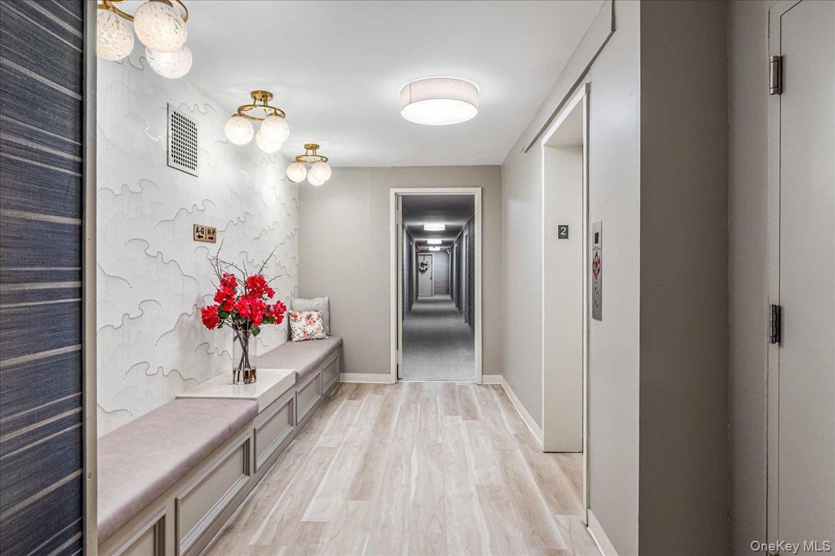 10 Lenox Road, Unit 2F Rockville Centre, NY 11570 - Photo 3 of 21 a view of a hallway with a chandelier