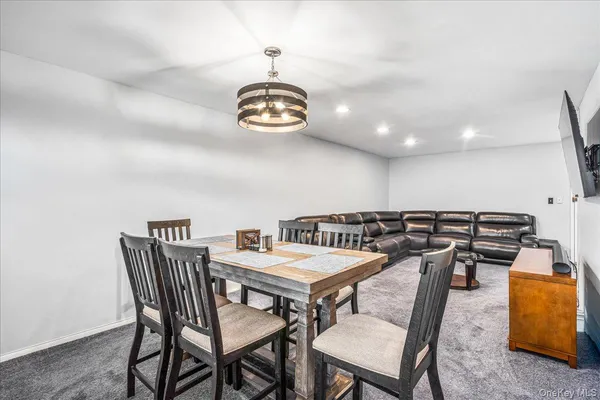 a view of a dining room and chairs