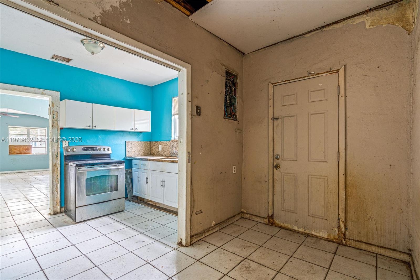 1045 Southwest 20th Avenue Miami, FL 33135 - Photo 16 of 53 a kitchen with white cabinets a sink and appliances