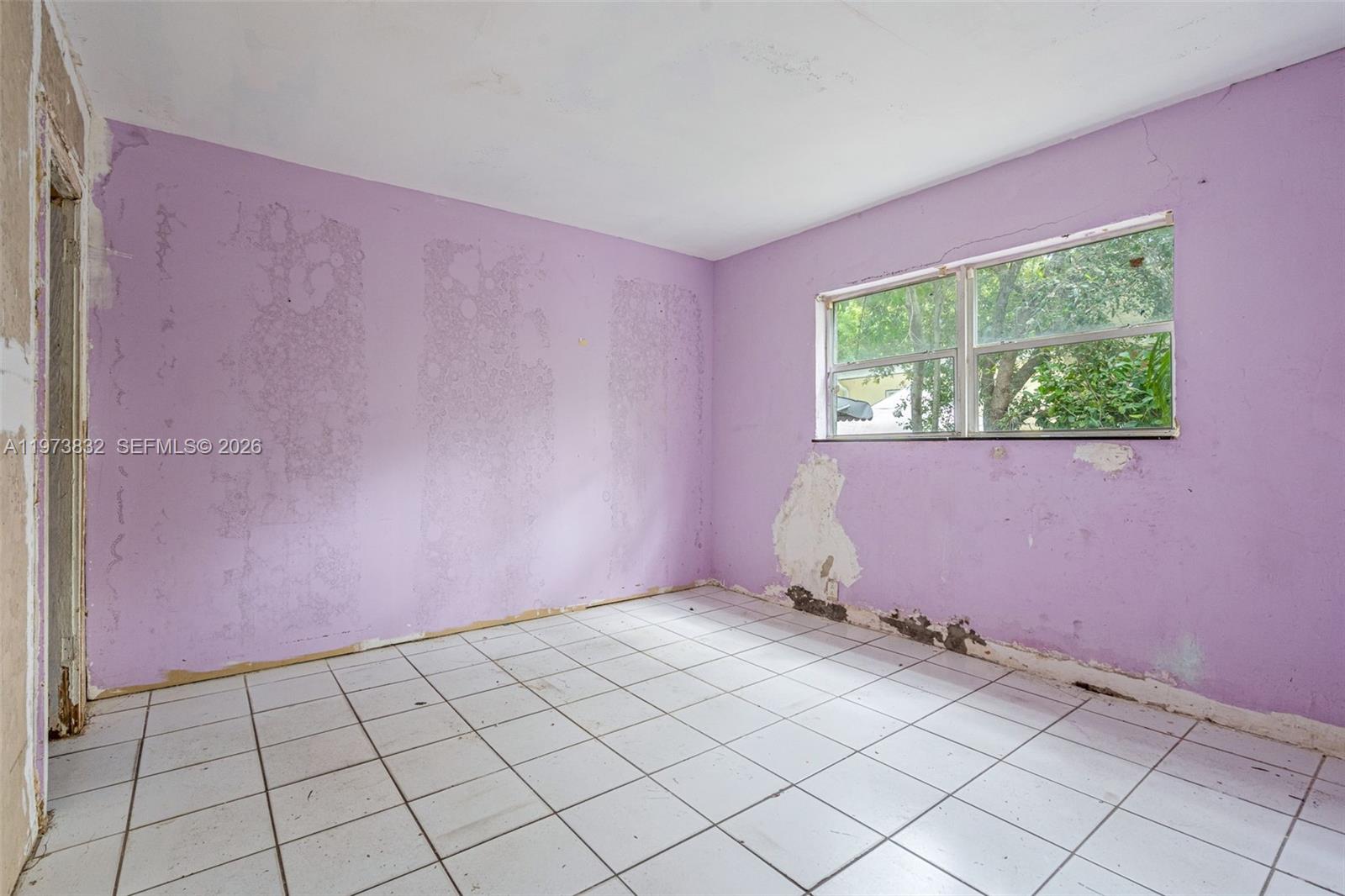1045 Southwest 20th Avenue Miami, FL 33135 - Photo 18 of 53 a view of an empty room with a window