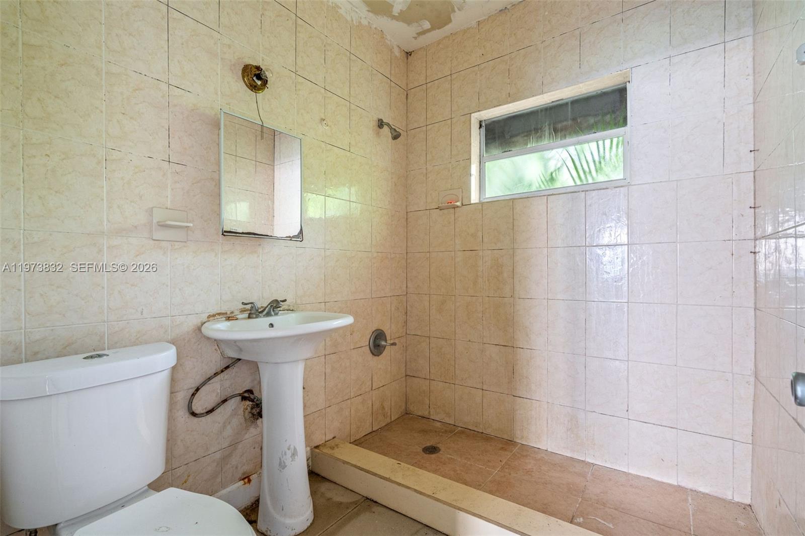 1045 Southwest 20th Avenue Miami, FL 33135 - Photo 20 of 53 a bathroom with a toilet sink and shower