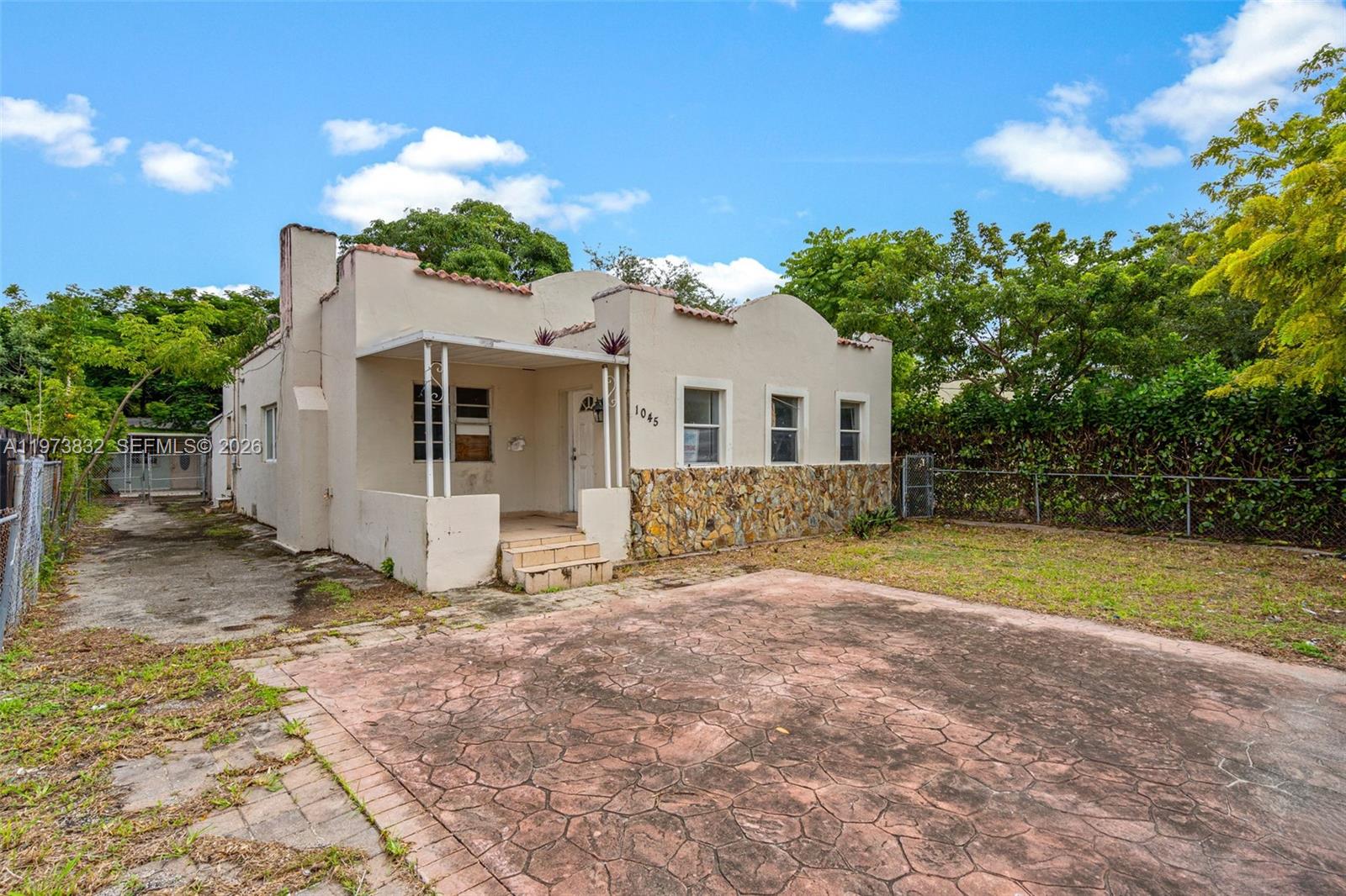 1045 Southwest 20th Avenue Miami, FL 33135 - Photo 2 of 53 a view of a house with a yard