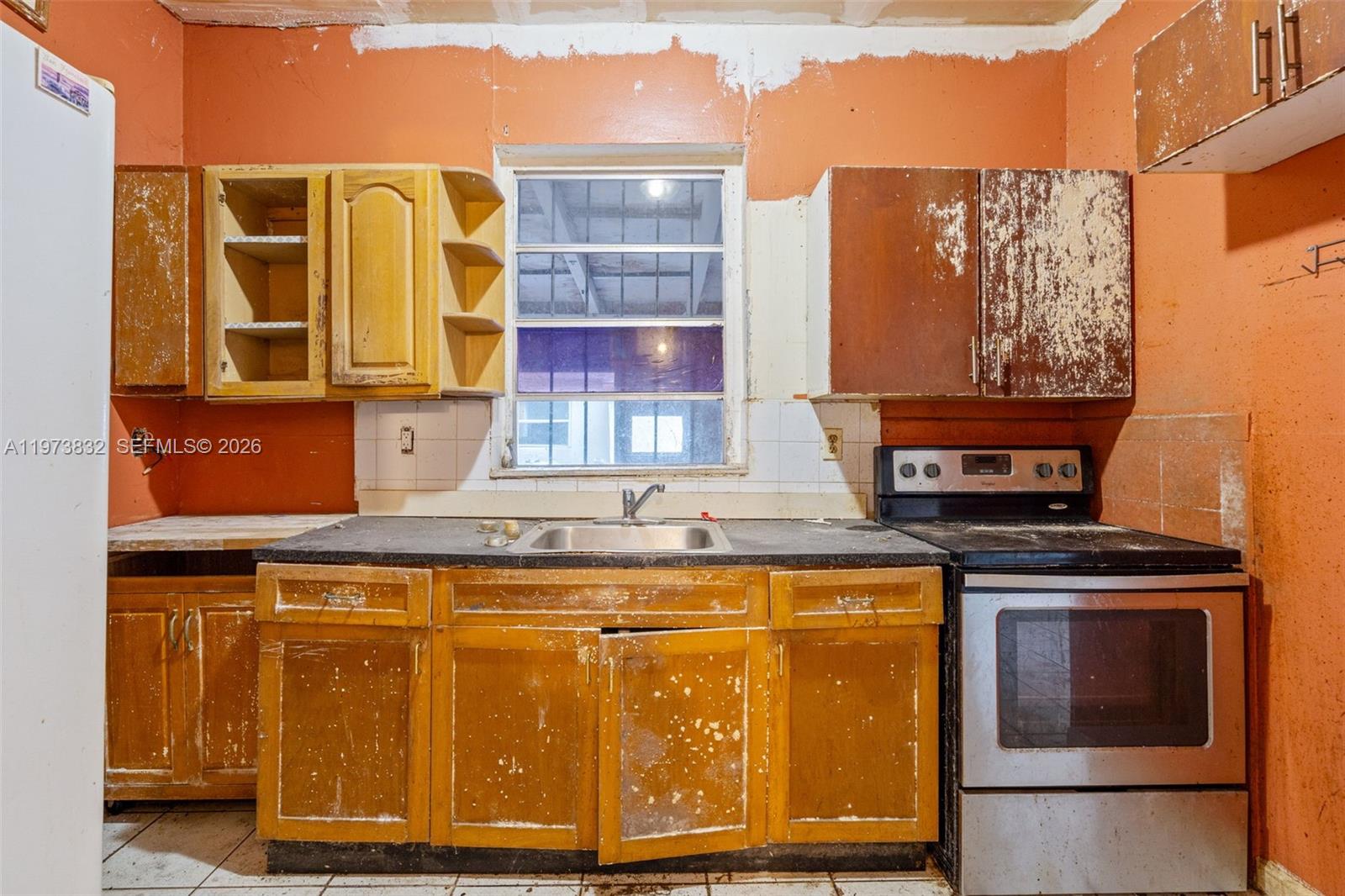 1045 Southwest 20th Avenue Miami, FL 33135 - Photo 31 of 53 a stove top oven sitting inside of a kitchen