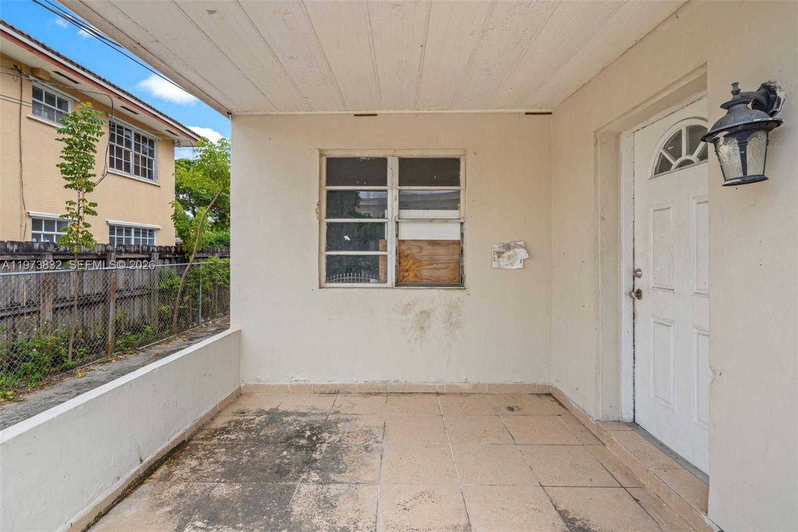 1045 Southwest 20th Avenue Miami, FL 33135 - Photo 4 of 53 a view of empty room with wooden floor and fan
