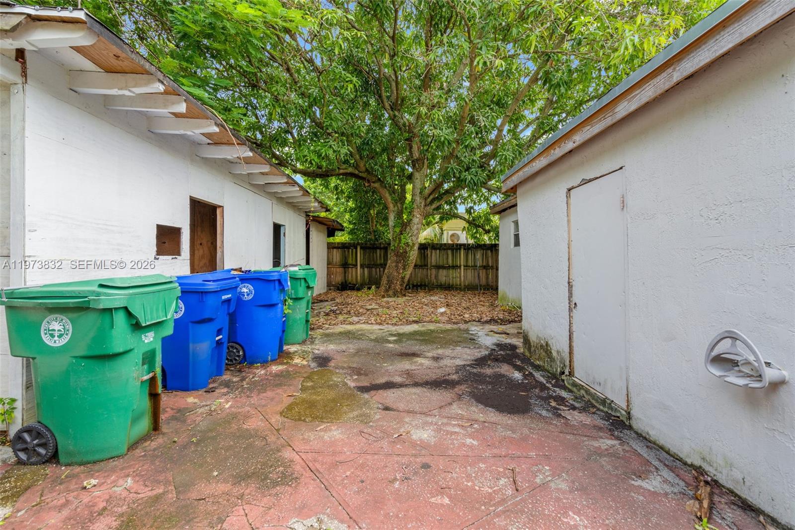 1045 Southwest 20th Avenue Miami, FL 33135 - Photo 45 of 53 a view of backyard with outdoor seating and trees