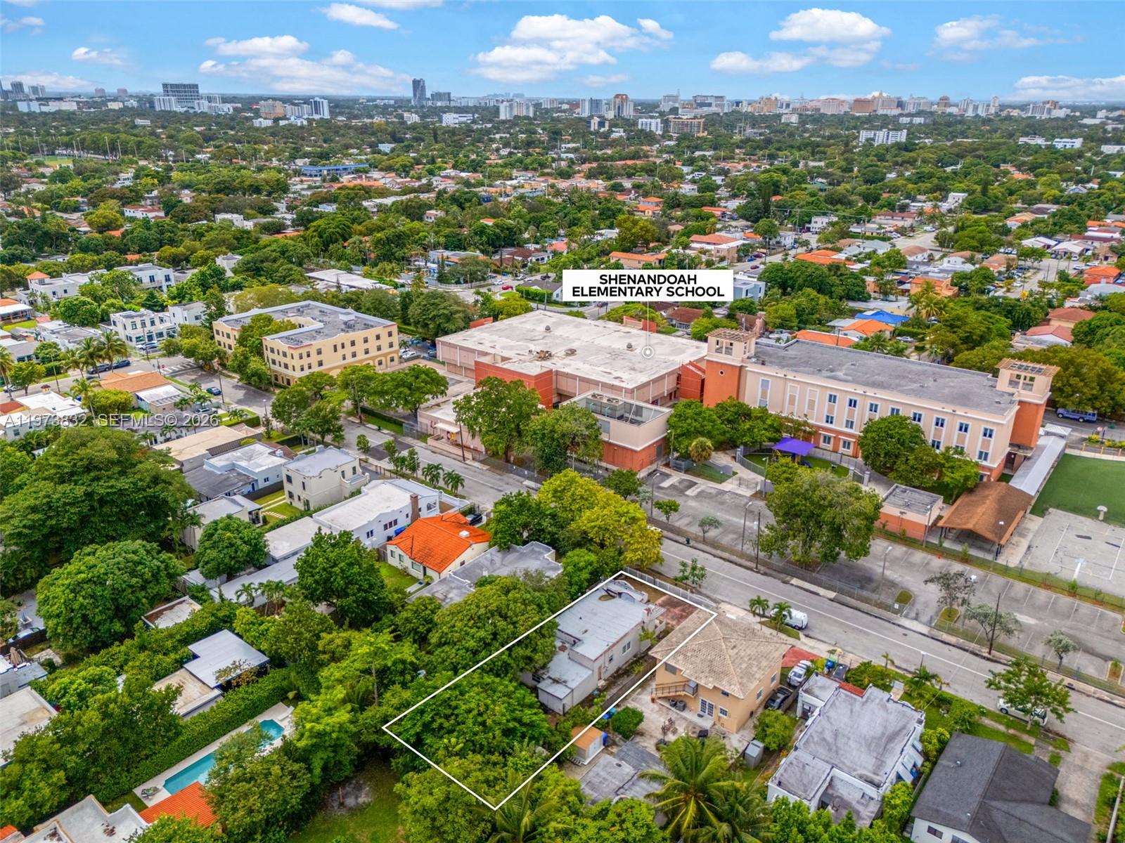 1045 Southwest 20th Avenue Miami, FL 33135 - Photo 51 of 53 an aerial view of residential houses with outdoor space and parking