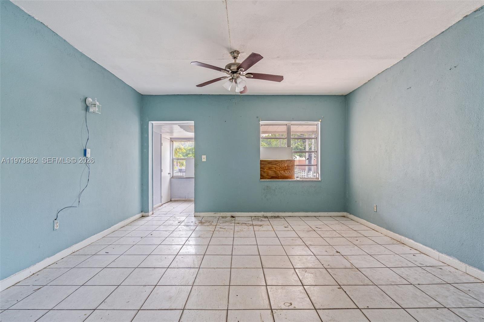 1045 Southwest 20th Avenue Miami, FL 33135 - Photo 8 of 53 a view of an empty room and window