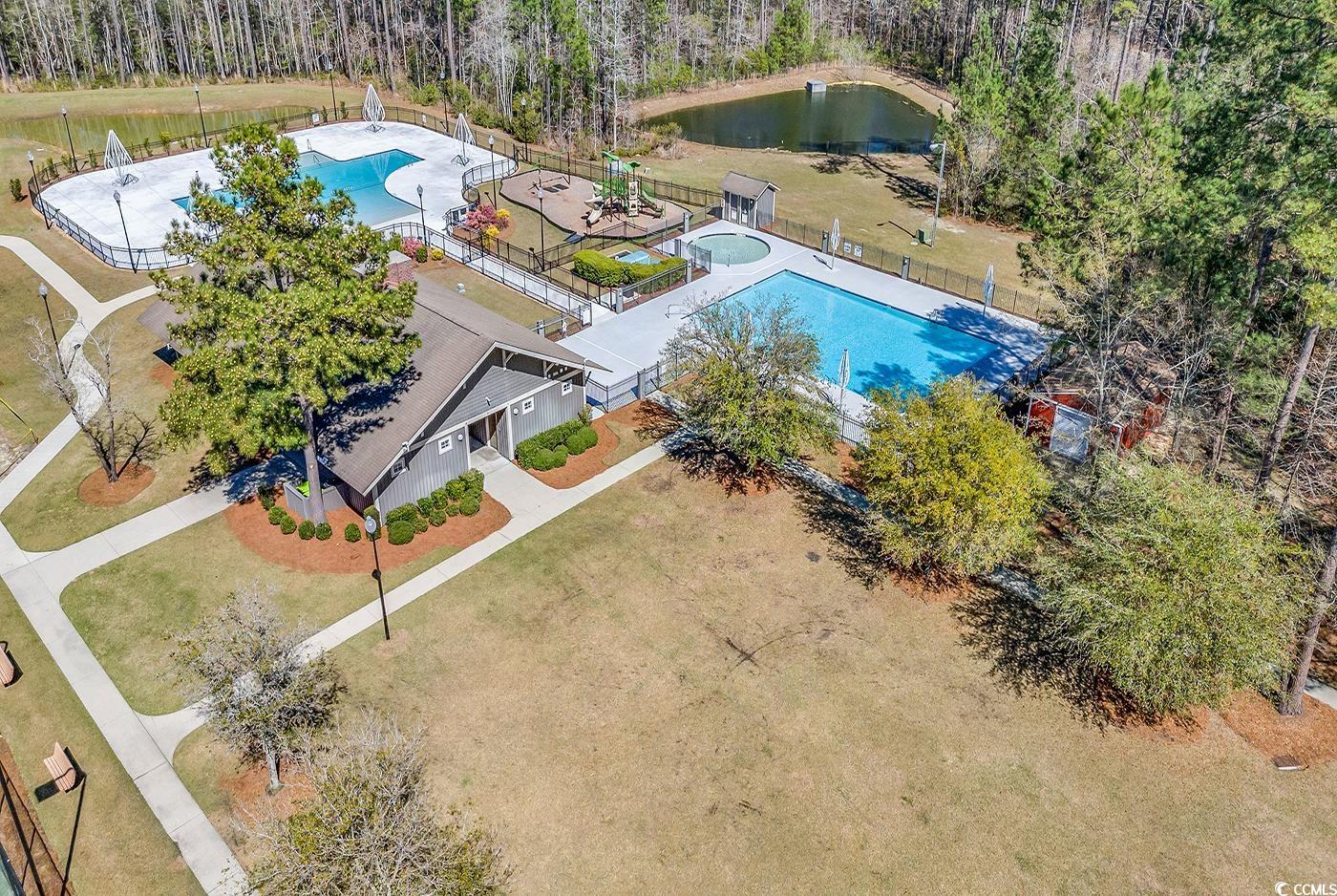1005 Elysium Court Murrells Inlet, SC 29576 - Photo 35 of 37 Aerial view of a pool area and a nearby body of water