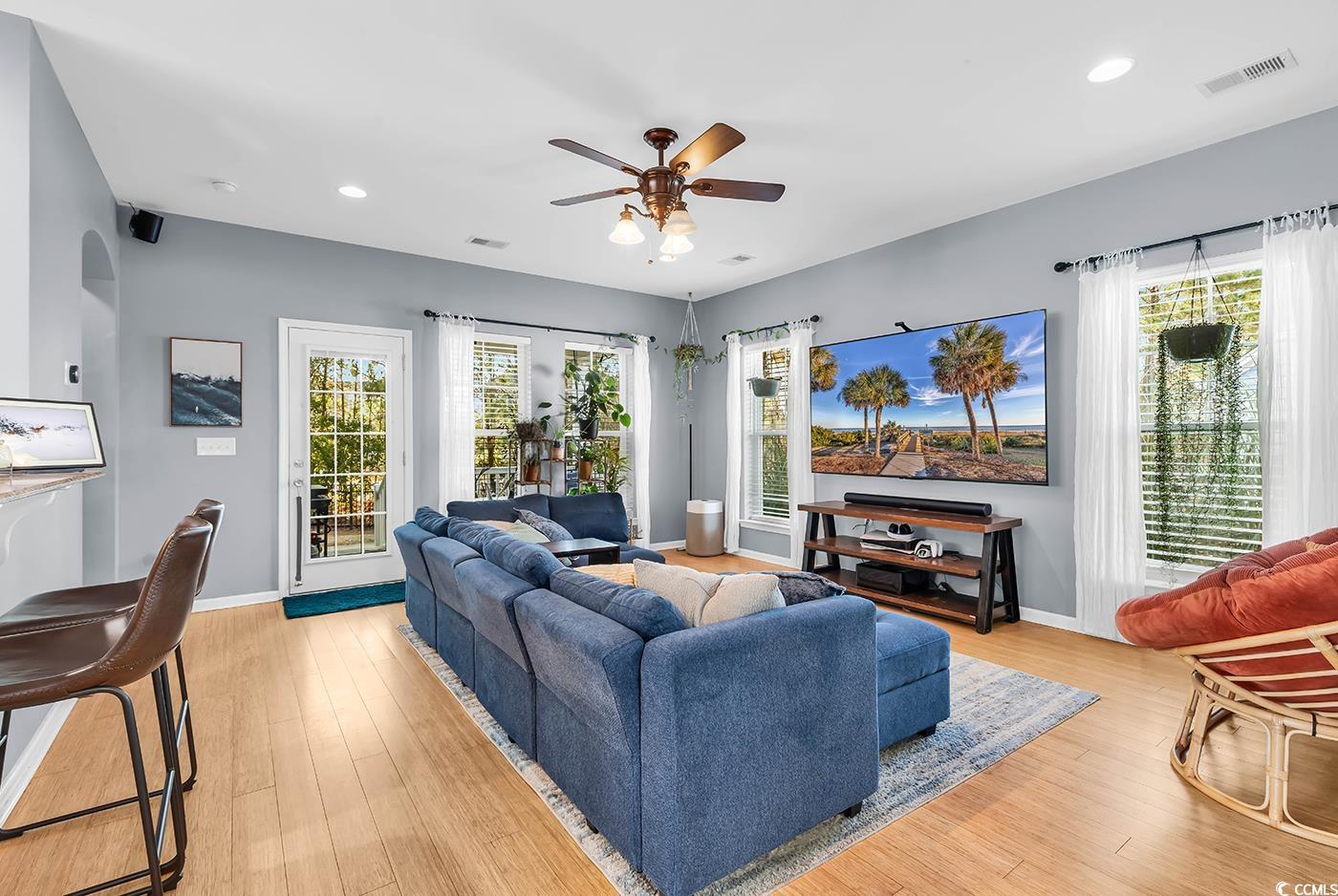 1005 Elysium Court Murrells Inlet, SC 29576 - Photo 9 of 37 Living area with a ceiling fan, recessed lighting, healthy amount of natural light, and light wood-style floors