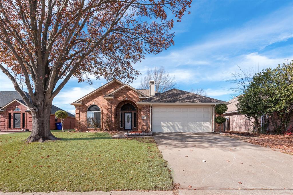 106 Villanova Circle Forney, TX 75126 - Photo 2 of 26 a front view of a house with a yard and garage