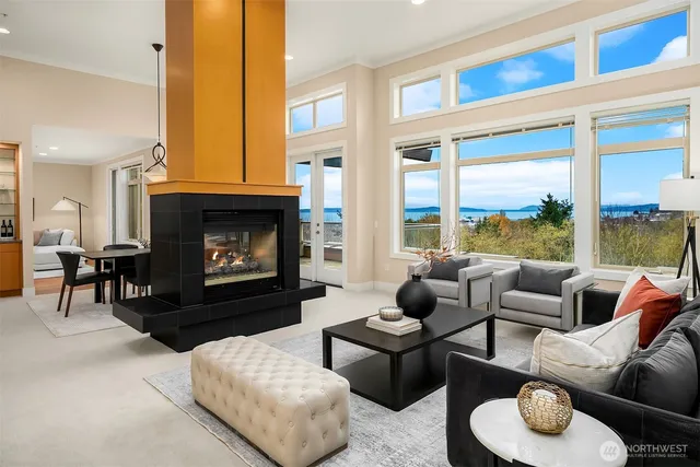 a living room with furniture a window and a fireplace