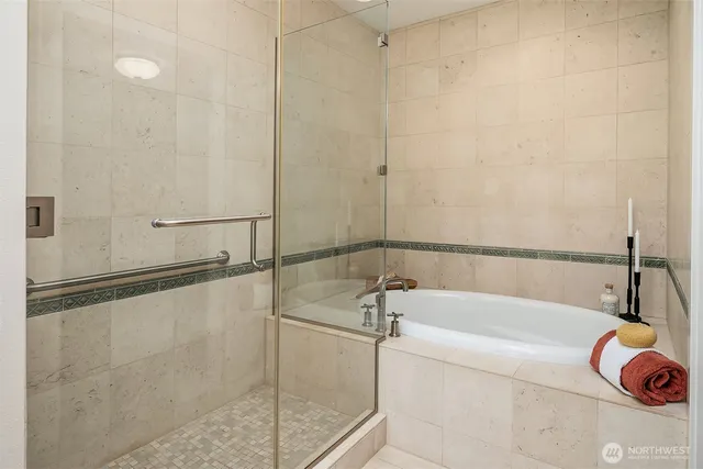 a bathroom with a bathtub and a shower