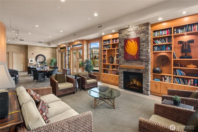 a kitchen with stainless steel appliances granite countertop a sink a stove and a refrigerator