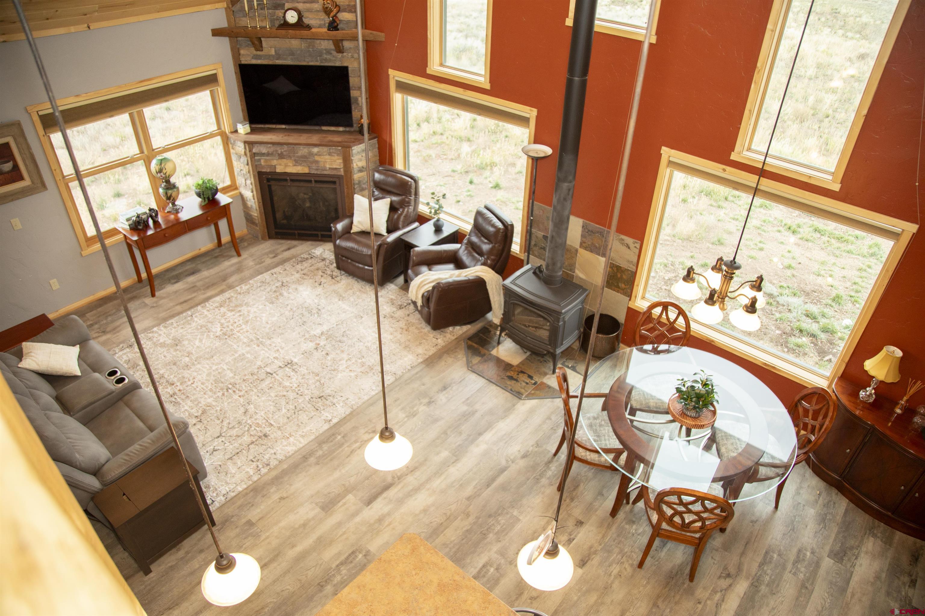 258 Diamond Road Creede, CO 81130 - Photo 16 of 30 a living room with furniture and a floor to ceiling window