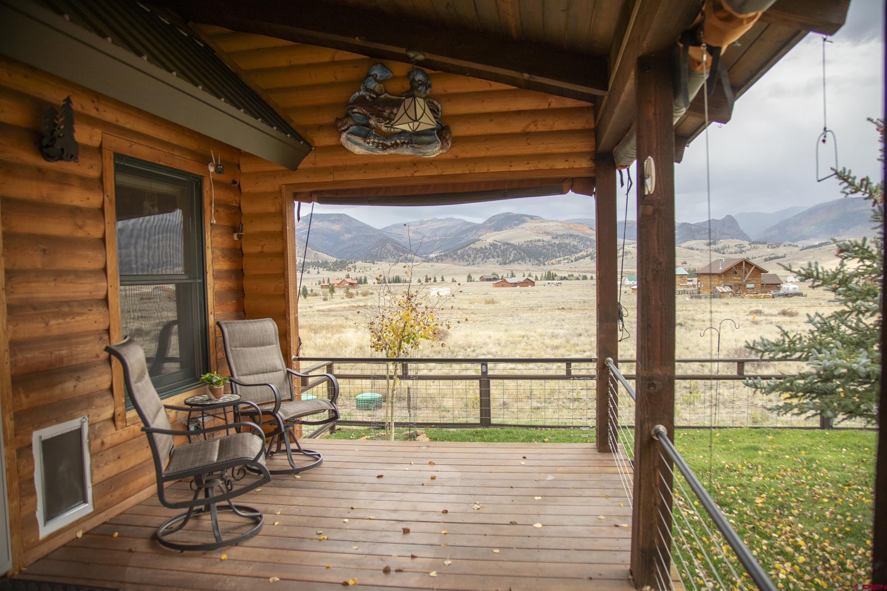 258 Diamond Road Creede, CO 81130 - Photo 2 of 30 a view of a room with wooden floor and windows