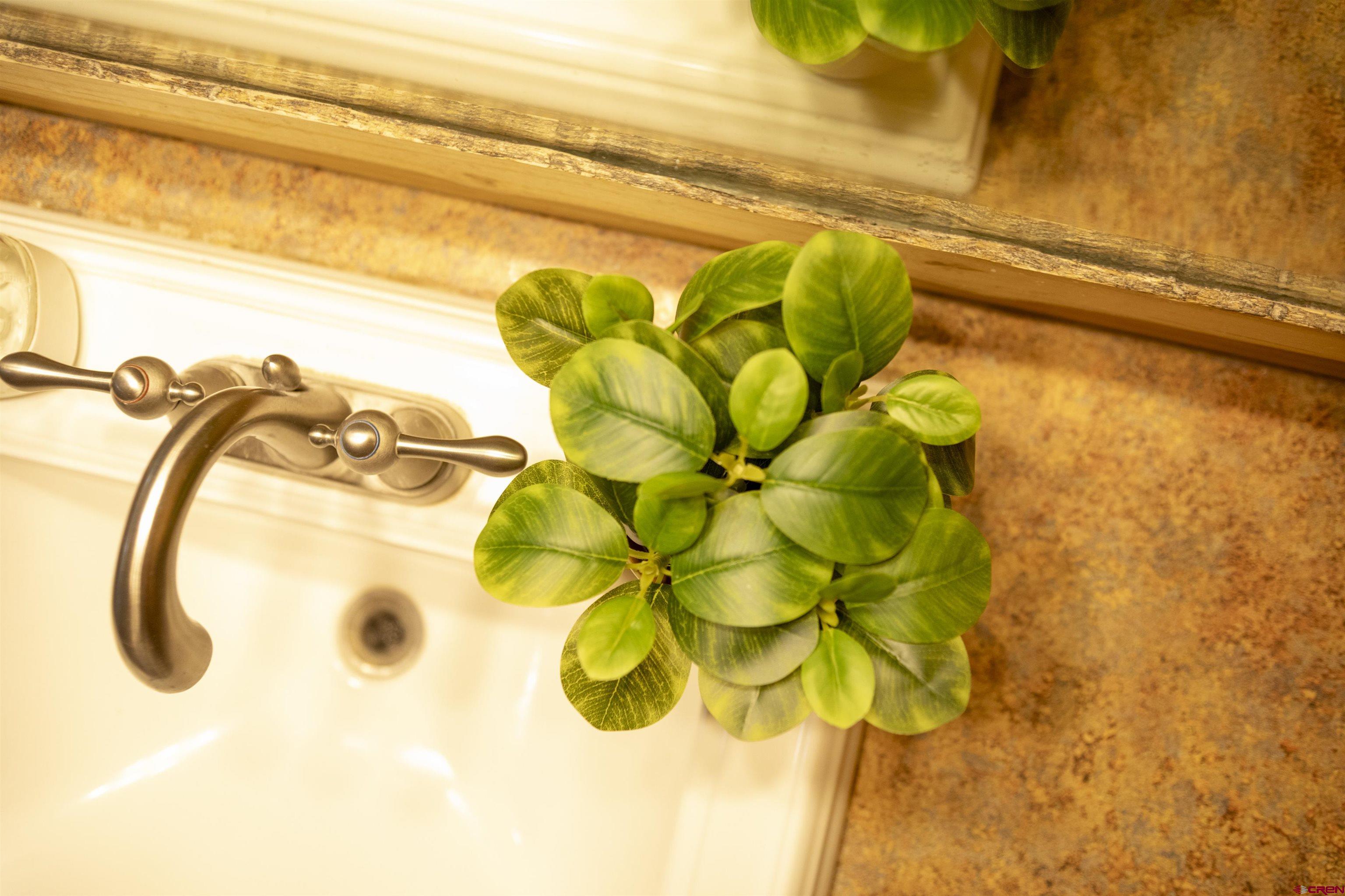 258 Diamond Road Creede, CO 81130 - Photo 24 of 30 a bathroom with a granite countertop sink and a mirror