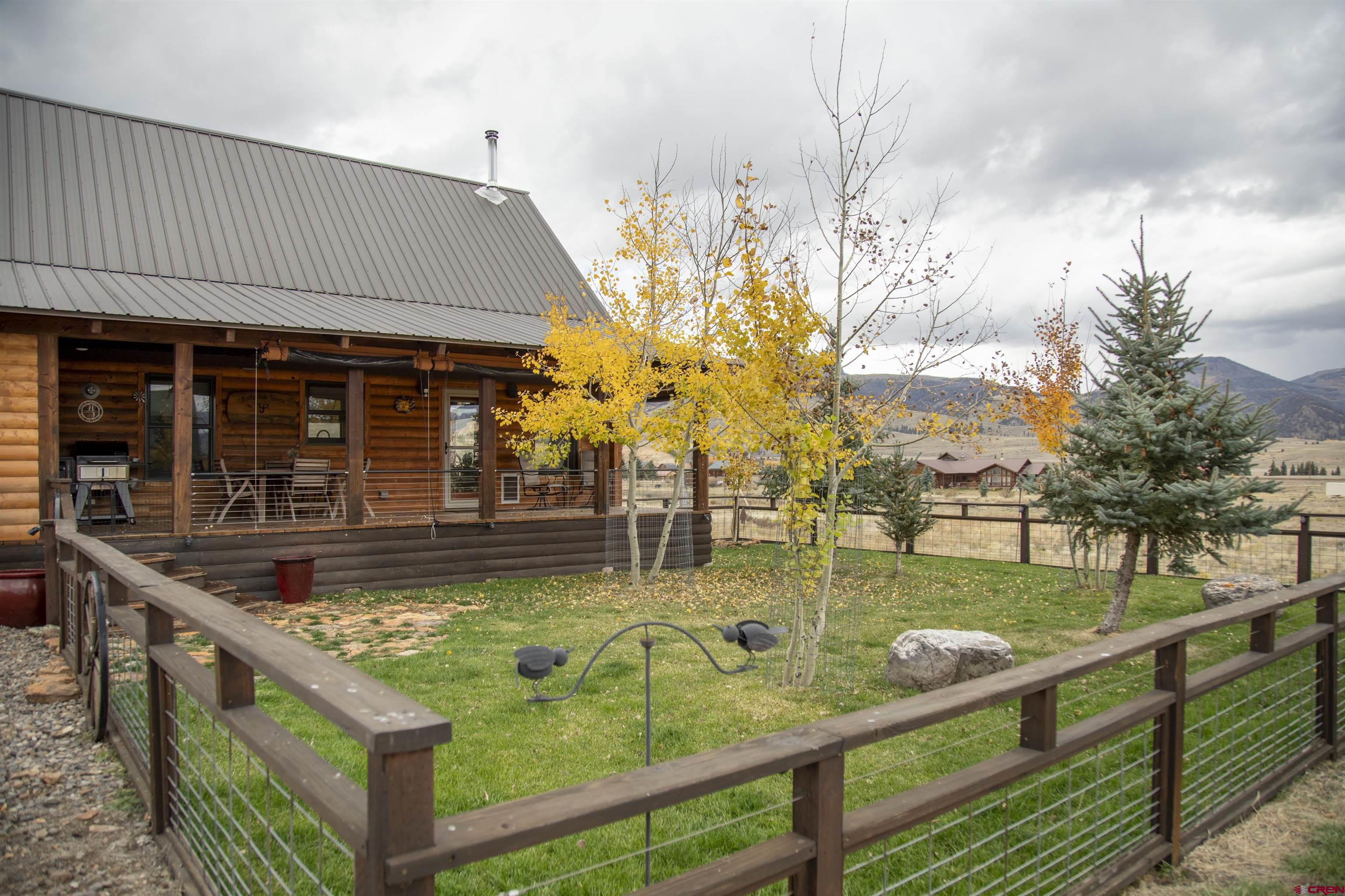 258 Diamond Road Creede, CO 81130 - Photo 25 of 30 a view of a house with swimming pool and sitting area