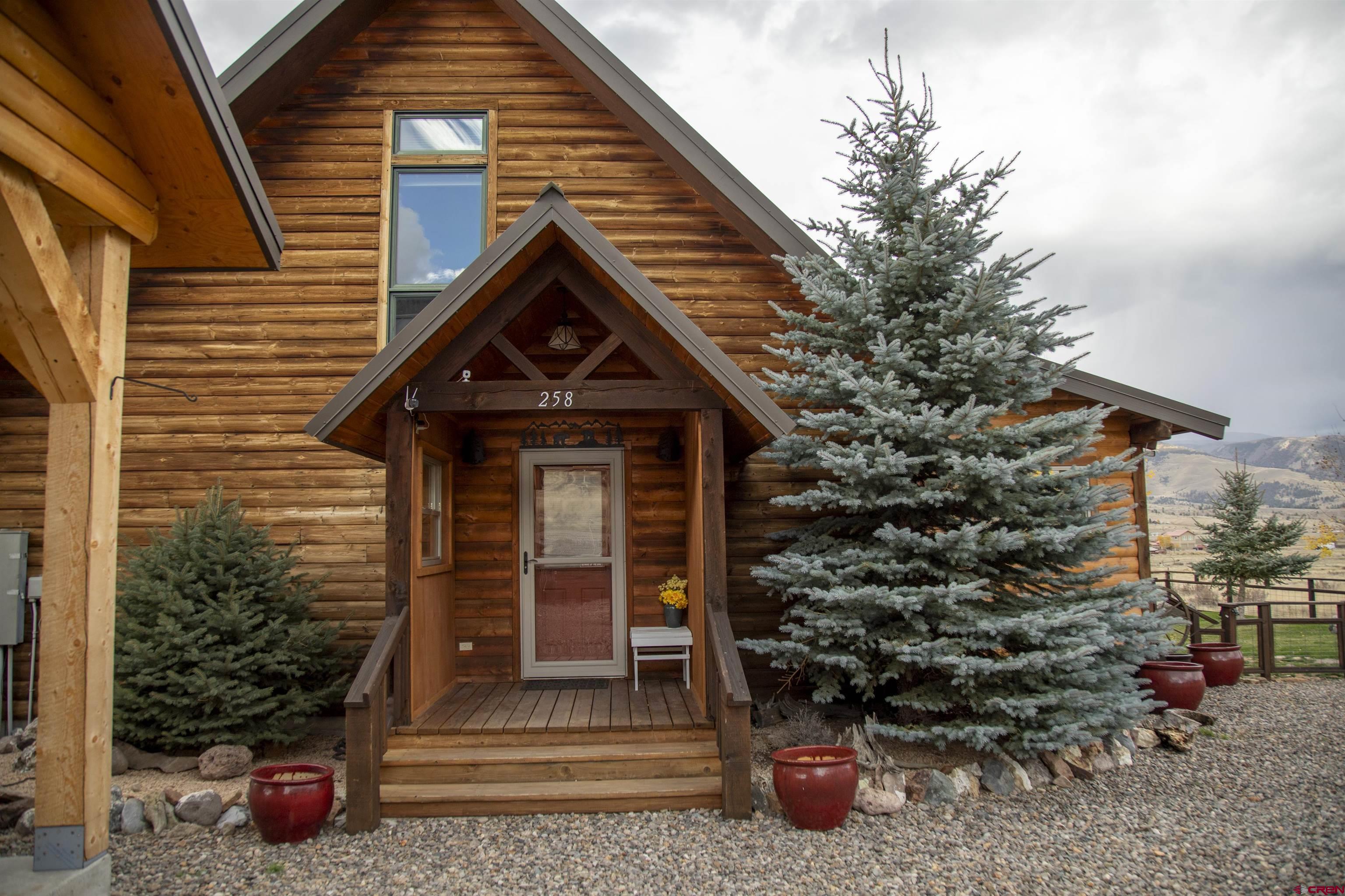 258 Diamond Road Creede, CO 81130 - Photo 27 of 30 a front view of a house with a garden