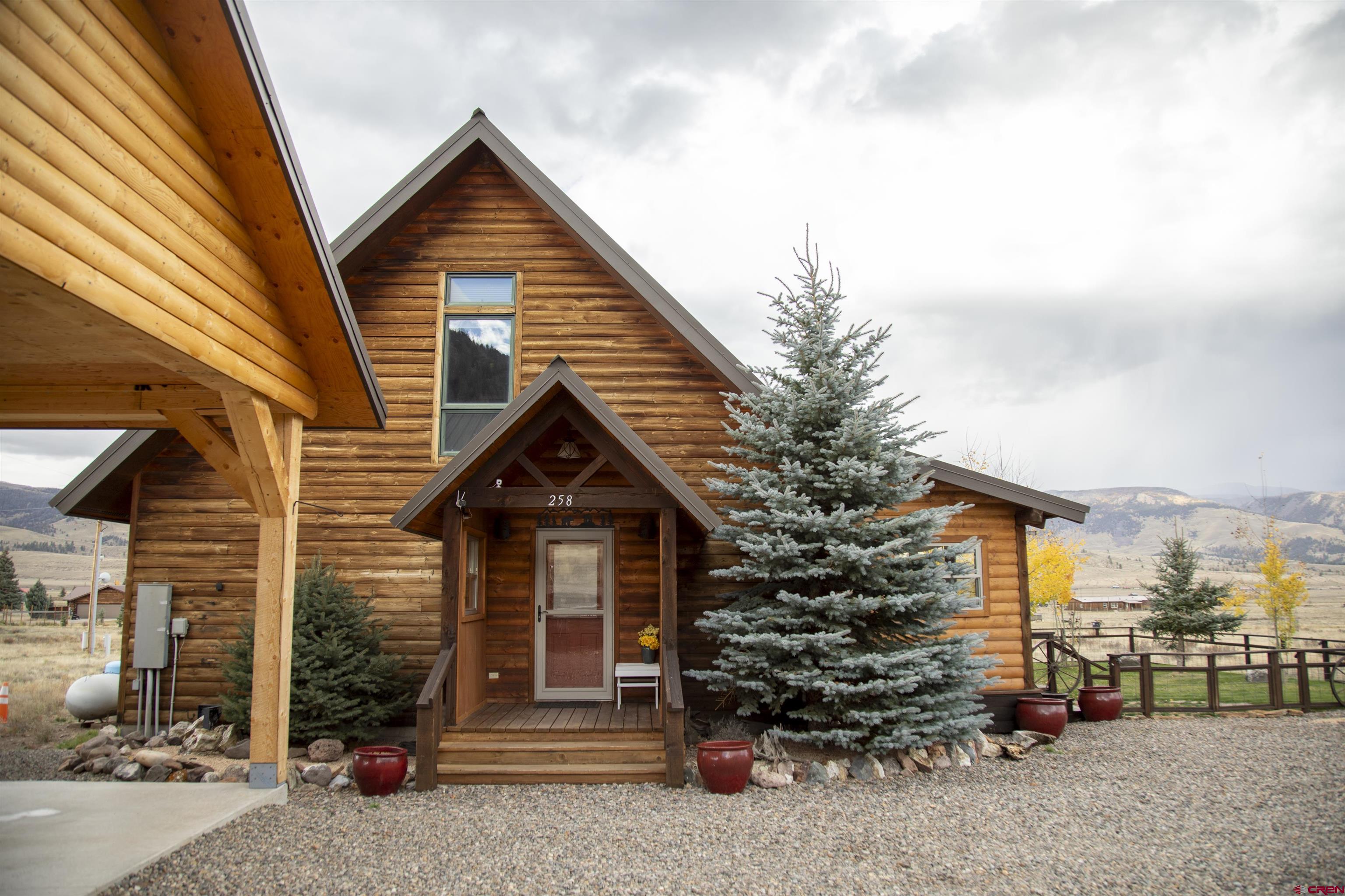 258 Diamond Road Creede, CO 81130 - Photo 3 of 30 a front view of a house with a garage