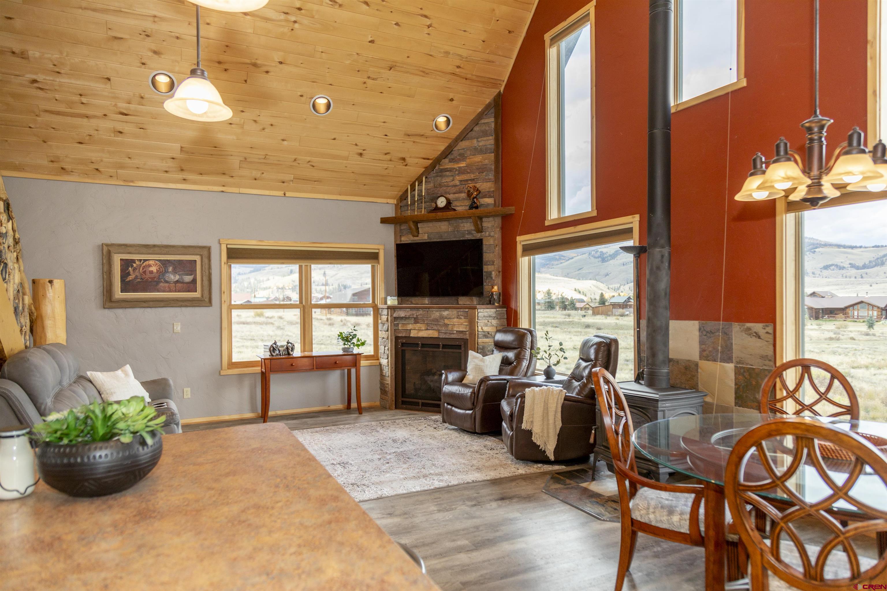 258 Diamond Road Creede, CO 81130 - Photo 10 of 30 a living room with fireplace furniture and a flat screen tv