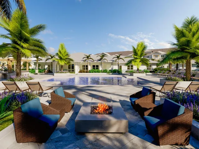 a outdoor space with patio couch and a potted plant