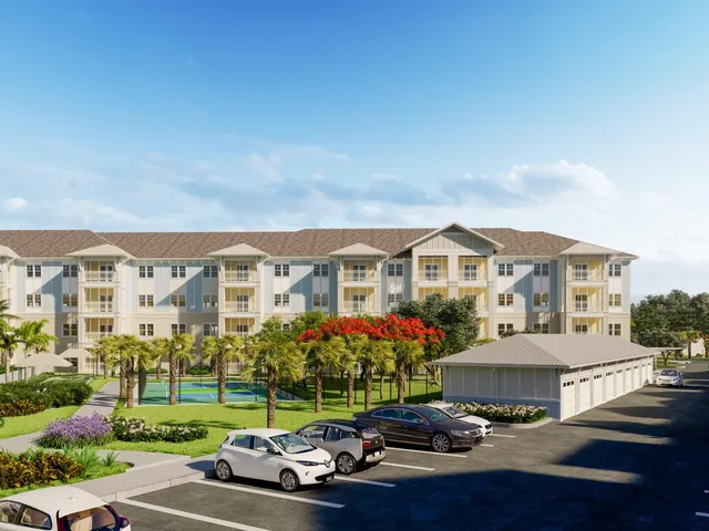 a front view of a house with a garden and trees