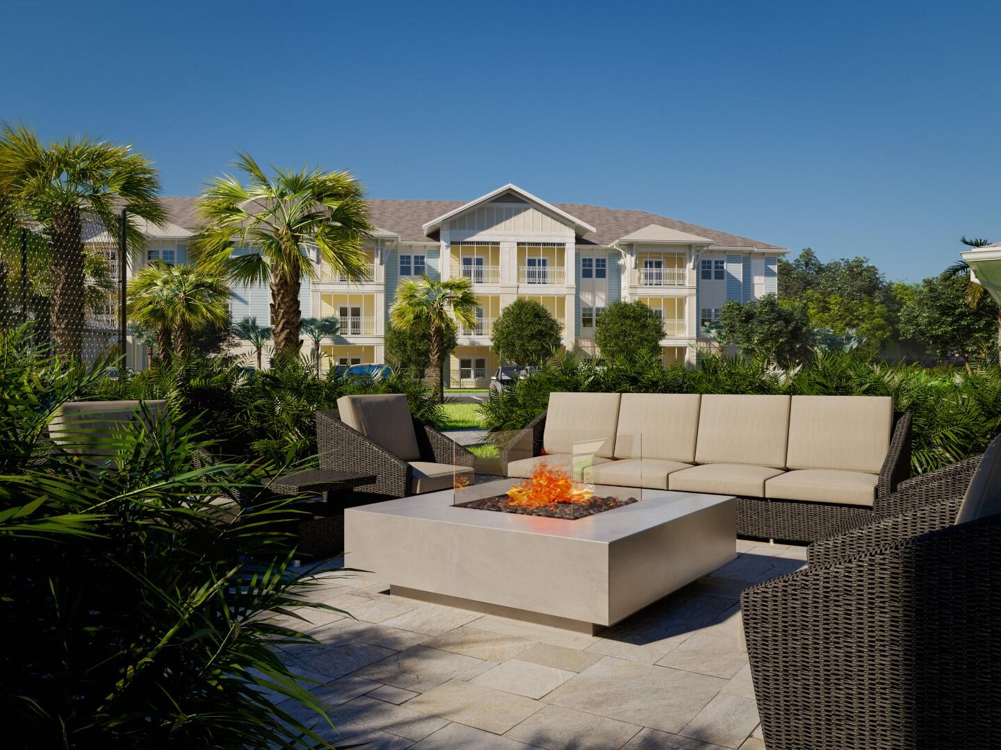 1916 Northwest Federal Highway, Unit 3106 Stuart, FL 34994 - Photo 17 of 26 a view of a patio with couches table and chairs and potted plants