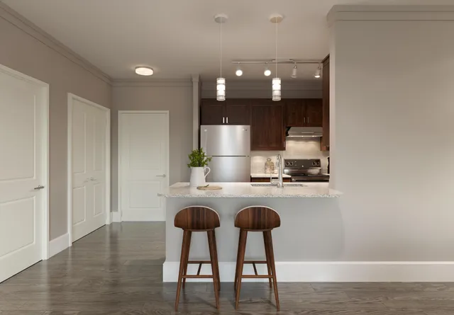 a kitchen with sink and refrigerator